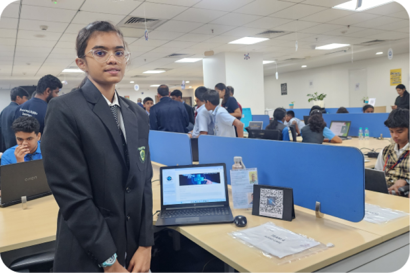 A student with a laptop at the AI/ML bootcamp